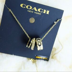 Coach Gold black and white charm Necklace